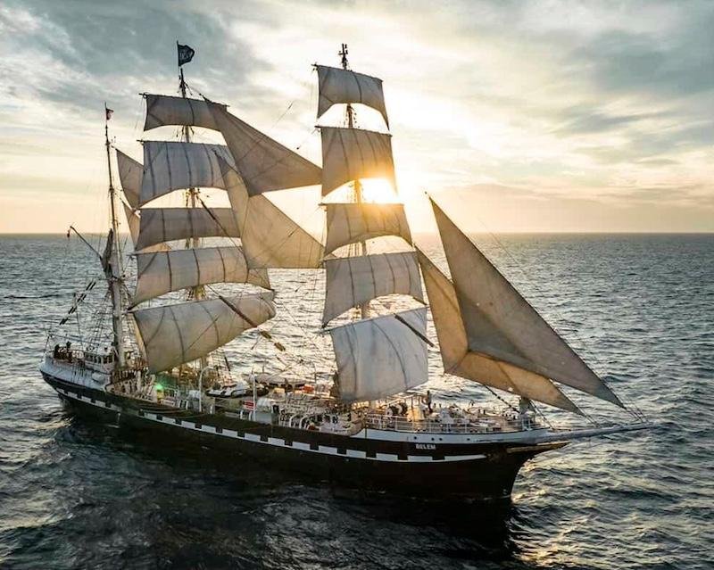 Historic tall sailing ship on open water