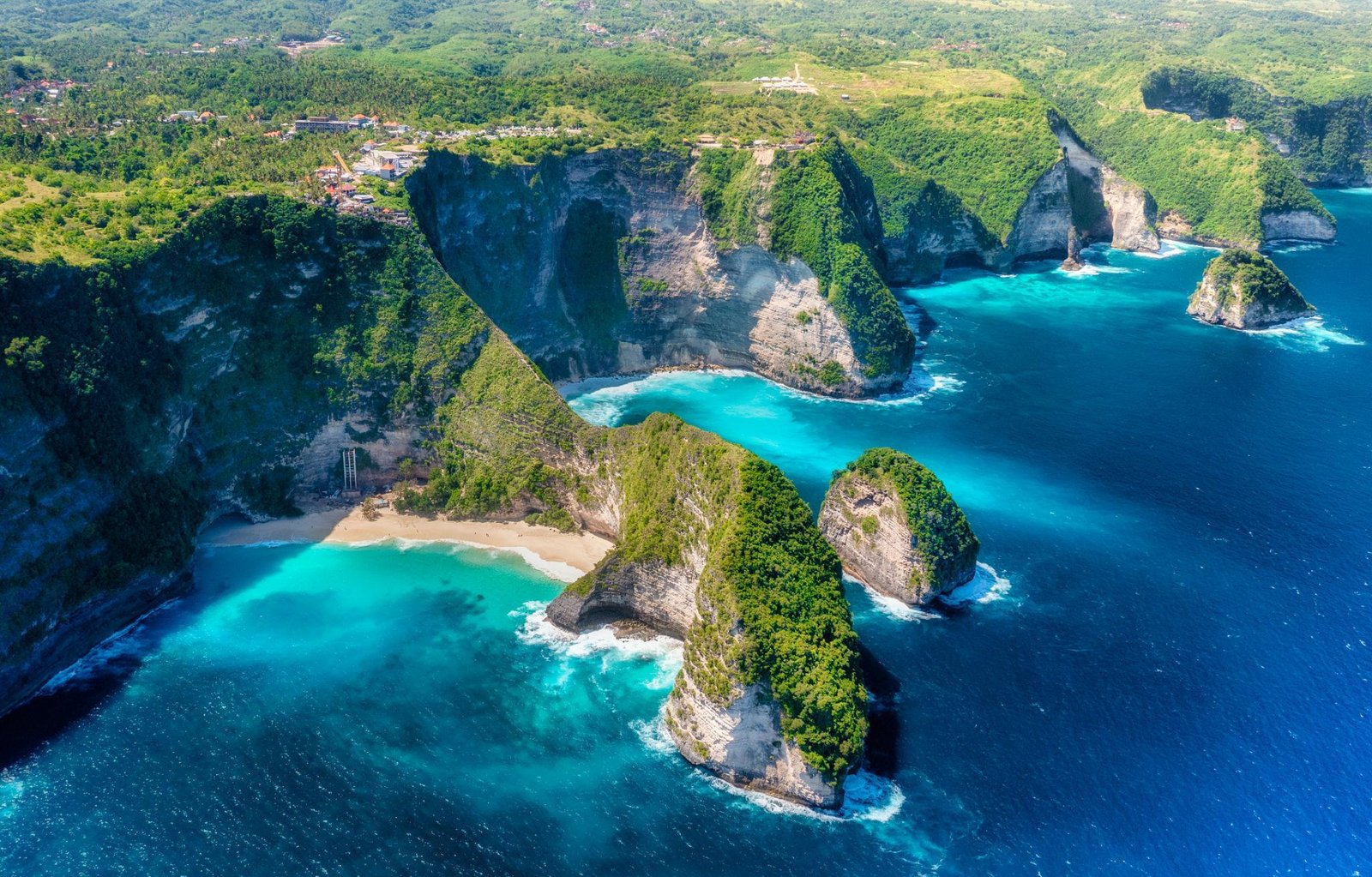 Aerial view of dramatic island cliffs and turquoise sea